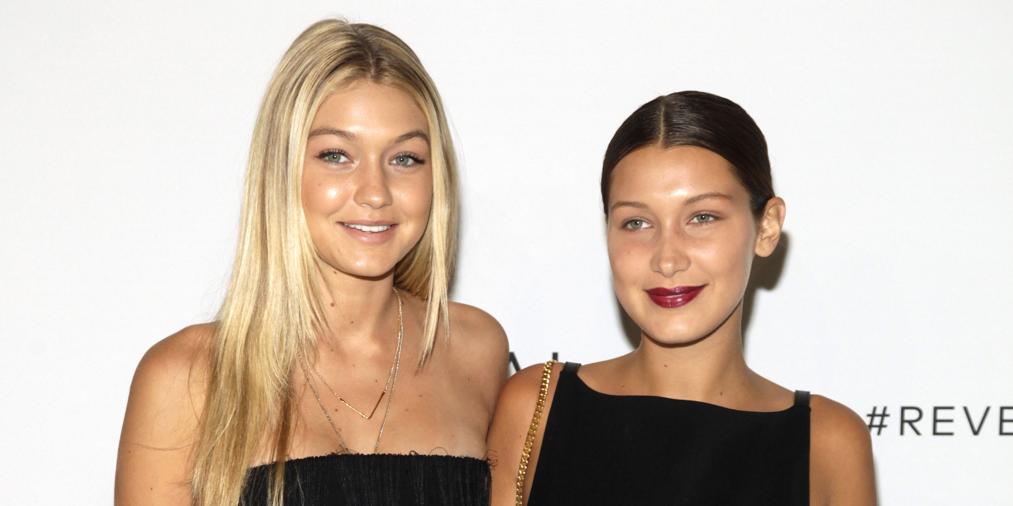 Gigi Hadid, left, and Bella Hadid, right, attend the REVEAL Calvin Klein launch event on Monday, Sept. 8, 2014 in New York. (Photo by Andy Kropa/Invision/AP)